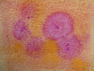 Droplets of Cobalt Violet onto wet Raw Sienna on Cold Press paper